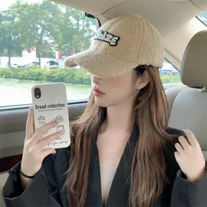 Beige sherpa baseball hat for women, cute fleece winter cap with letter embroidery and cozy fit.