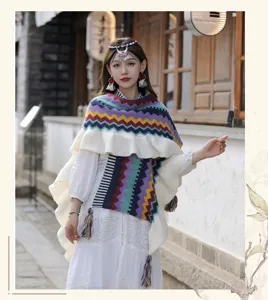 Bohemian rainbow knit shawl cape for women, stylish ruffle split design, warm travel wear.