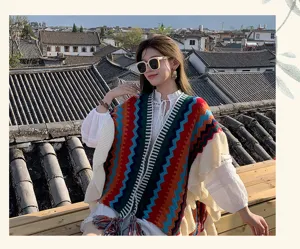 Bohemian colorful zigzag knitted poncho for women, perfect for travel and casual outdoor wear.
