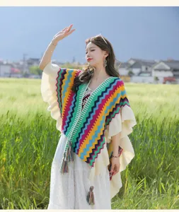 Bohemian rainbow striped knitted poncho with ruffles and fringe for women travel wear cape shawl.