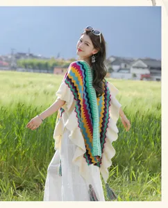 Bohemian rainbow fringe knitted poncho shawl for women, warm travel cape detail view.