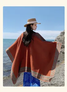 Bohemian orange knit shawl poncho, thick warm cape for travel, ethnic geometric design.