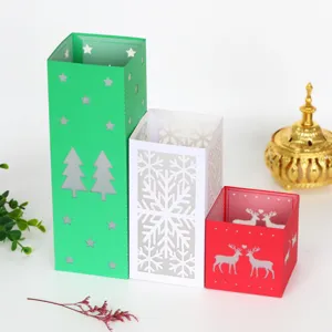 Christmas laser cut hollow paper candle lantern set with tree snowflake and deer designs.