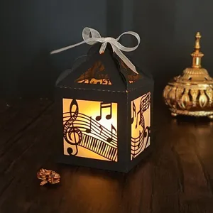 Lanterne en papier boîte à musique découpée au laser avec lumière chaude et nœud déc