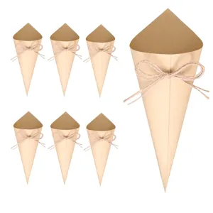 Kraft paper confetti cones detail view, wedding party DIY flower petal holders with twine bows.
