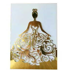 Primer plano detalle silueta vestido papel dorado metálico corte láser para invitación.
