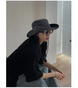 Stylish dark grey outdoor bucket hat with chin strap, perfect for sun protection.