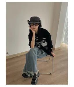 Vintage denim bucket hat for women and men, retro outdoor sun protection styling accessory.