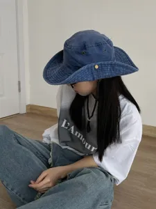 Vintage washed blue denim bucket hat for women, wide brim outdoor sun protection hat.