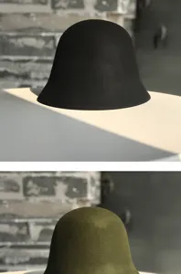 Close-up detail of vintage wool bell hat in black and olive green, soft warm winter bucket hat.