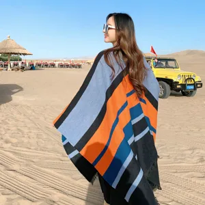 Detail view of the autumn winter ethnic style colorblock split cloak shawl for women warm cashmere feel.