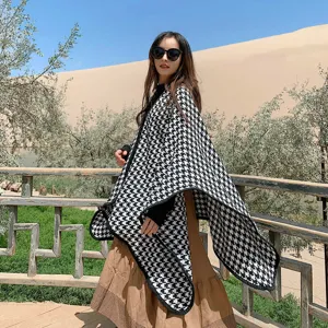 Black and white houndstooth split shawl detail, cozy imitation cashmere cloak for travel outdoor scenic view.