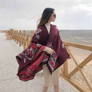 Outdoor scene detail of women ethnic style woolen cloak, showcasing split design and pattern.