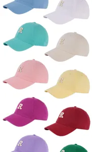 Detailed view of colorful Korean style soft top baseball caps with embroidered letter R design.