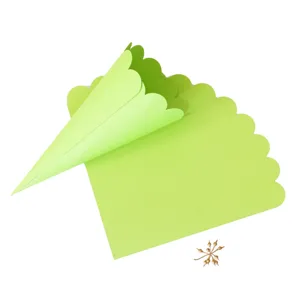 Green scalloped paper confetti cones for wedding parties, DIY flower holder and decor.