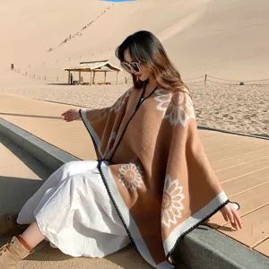 Detail shot of a warm cashmere-feel ethnic sunflower cloak, perfect for travel and outdoor wear.