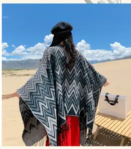 Detailed view of the bohemian chevron knitted poncho, showcasing the stylish zigzag pattern.