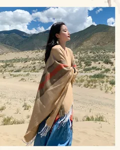 Detailed shot of a bohemian women poncho shawl, thickened warm imitation cashmere for travel.