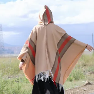Autumn winter hooded tassel knitted poncho cape, warm ethnic style travel wear for women detail.