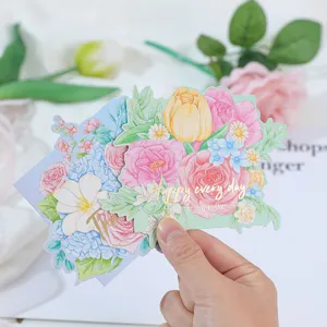 Detailed view of gold-stamped floral greeting card featuring beautiful bouquet illustrations.