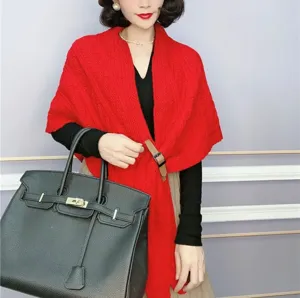 Red knitted shawl cape for women, warm winter triangular poncho with stylish leather buckle.