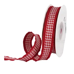 Red and white houndstooth ribbon with ruffled edges for gift wrapping and DIY floral crafts.