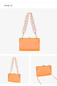 Elegant orange transparent acrylic evening clutch bag with a thick resin chain handle