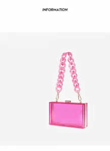 Transparent pink acrylic evening clutch bag with chunky chain handle for parties