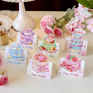 Detailed view of cute cartoon watercolor 3D birthday cake greeting cards with floral decor.