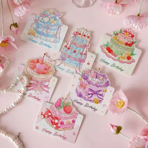 Close up detail of cute watercolor birthday cake greeting cards with floral background.