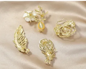 Detailed view of spring new acetate fresh water pearl brooch pin, showing back structure.