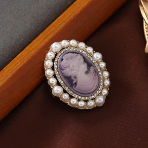 Elegant oval pearl cameo brooch featuring a vintage relief lady profile with rhinestones.