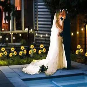 Outdoor solar sunflower garden lights glowing at night wedding pathway lawn landscape decoration