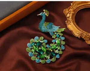 Stunning vintage rhinestone peacock brooch, detailed crystal accessory for winter sweaters.