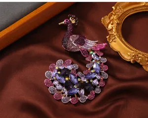 Exaggerated vintage peacock brooch with purple rhinestones for women sweater accessory detail view.