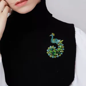 Vintage crystal peacock brooch for women, elegant oversized rhinestone pin for winter sweaters.