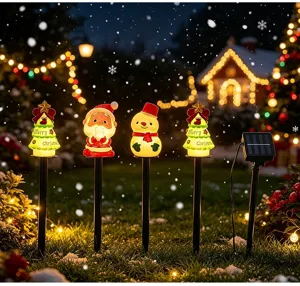Outdoor solar Christmas stake lights with colorful LED decorative figures for garden lawn yard.