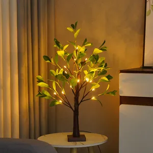 Detailaufnahme der LED künstlichen Baumleuchte mit warmem Licht für gemütliche Heim- und Partydeko.