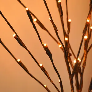 LED twig branch light detail, warm fairy lights for Nordic room decor and cozy atmosphere.