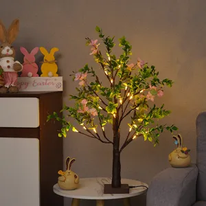 LED Osterbaum Licht mit künstlichen Blumen und warmen Lichtern für festliche Heimdeko und Partys.