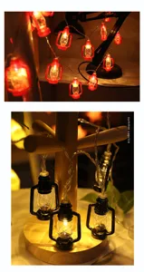 Detailed view of vintage LED lantern string lights with warm glowing bulbs for room decor.