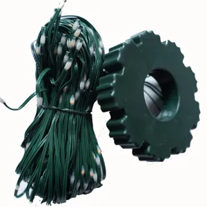 Green wire LED string lights with storage spool, perfect for Christmas tree holiday home decor.