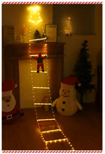 Vista detallada de la luz de escalera LED de Navidad con Papá Noel trepador y campana festiva.