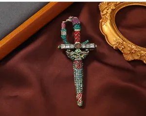 Vintage crystal sword brooch detailed shot, luxury rhinestone dagger pin for coats.