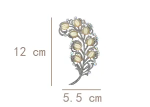 Luxury vintage style feather brooch with sparkling crystals and iridescent cabochons, 12cm.