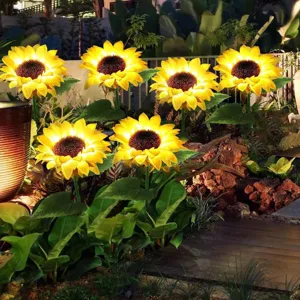 Outdoor solar sunflower garden light detail scene, glowing decorative lawn landscape lamp.