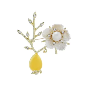 Elegant flower branch brooch featuring freshwater pearl, resin stone and sparkling rhinestones.