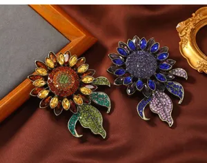Detailed view of vintage crystal rhinestone sunflower brooches with sparkling colorful gems.