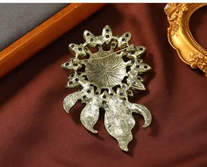 Detailed back view of vintage sunflower brooch with secure pin clasp mechanism and metal base.