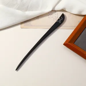 Elegante fermacapelli in legno di ebano con design di costellazione, accessorio moderno chic.
